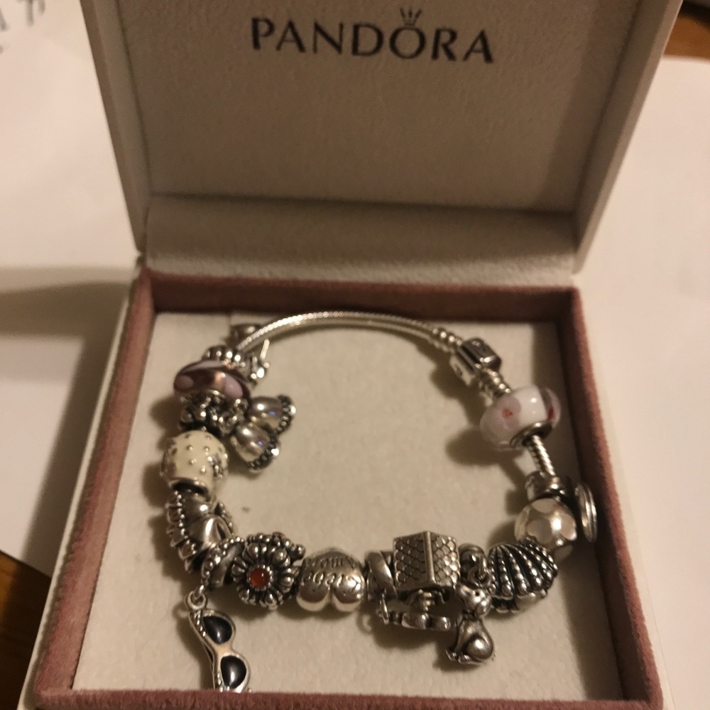 AUTHETIC PANDORA BRACELET W/ CHARMS.